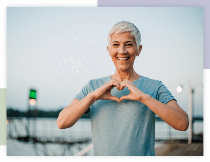 Person making a heart sign with fingers